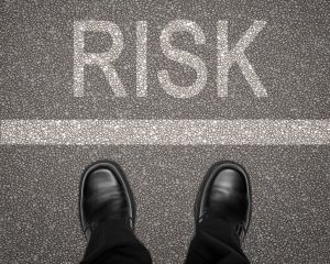 Man looking across the line at risk - Risk Management Principles